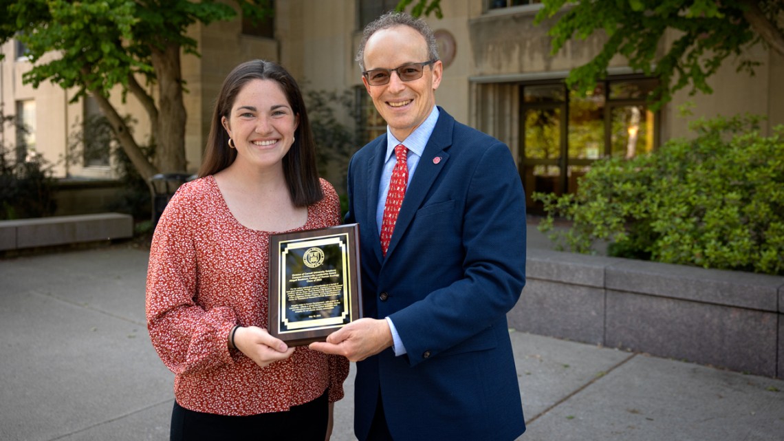 Abigail Boatmun ’23 receives the 2023 Campus-Community Leadership Award from Joel Malina, vice president for university relations.