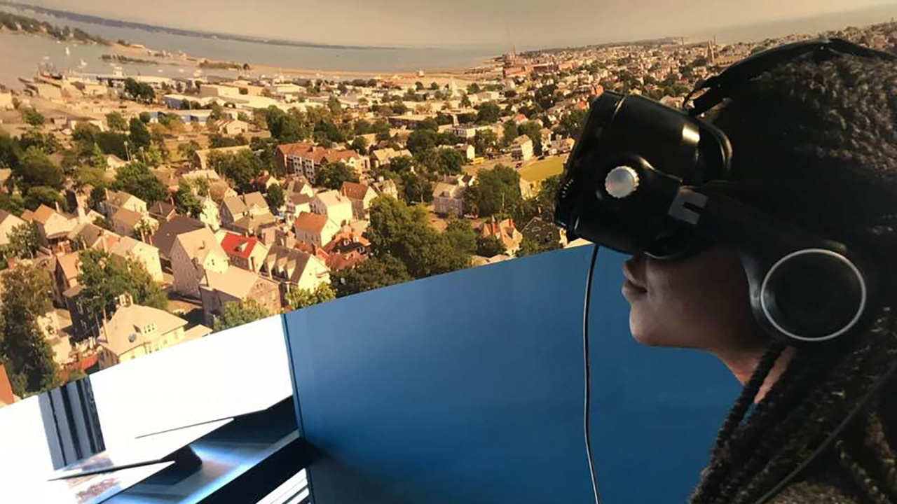A participant immersing themselves in Black Spaces Matter, a traveling collaborative exhibition, involving community, New Bedford Historical Society, students as well as local experts and organizations, curated by Pamela Karimi. Provided.